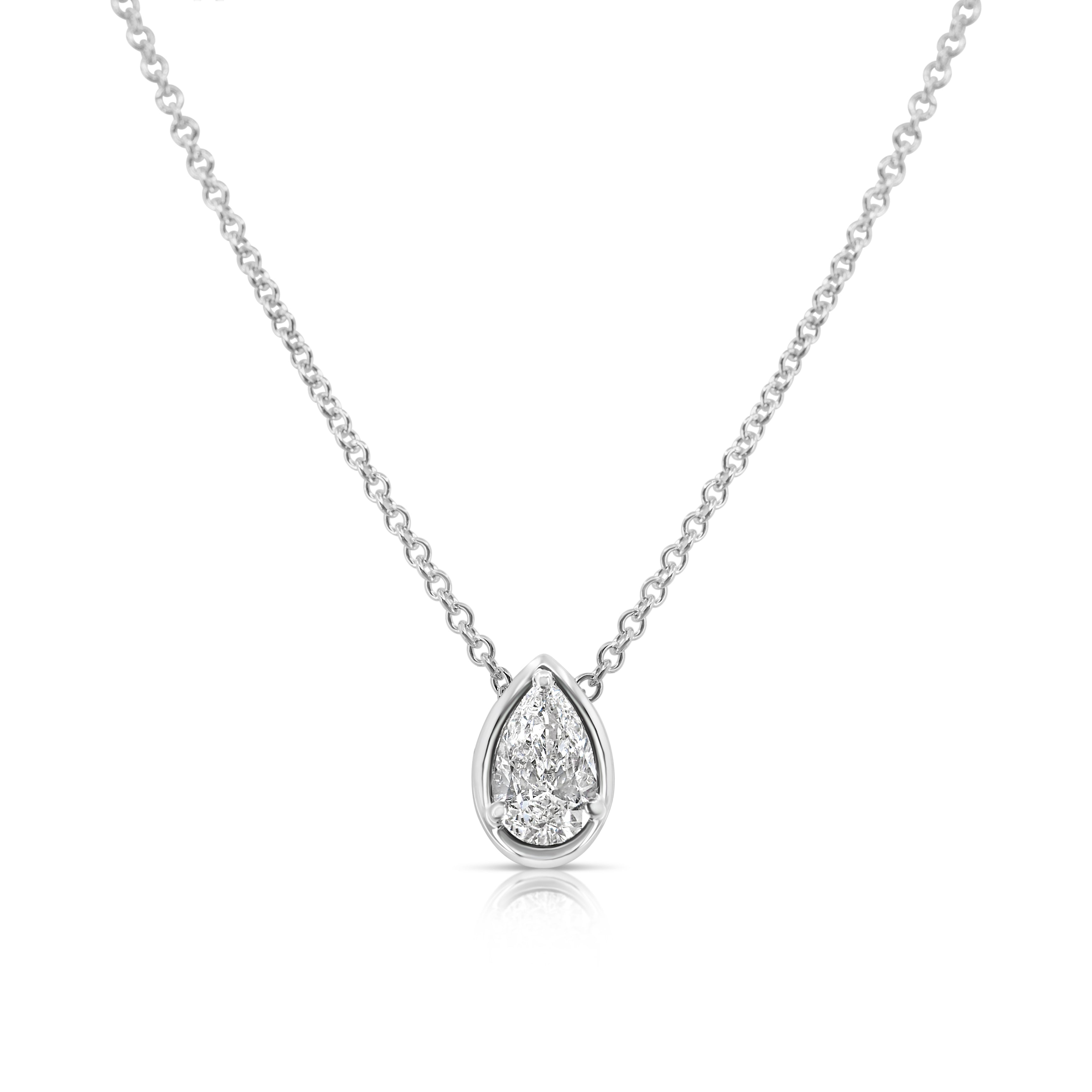 Front view of vertical pear-shaped diamond pendant necklace pointed up. The diamond is set in a white gold pear-shaped beveled setting, fixed with 3 rounded prongs. The white gold round-link chain connects at the back of the setting near the point.