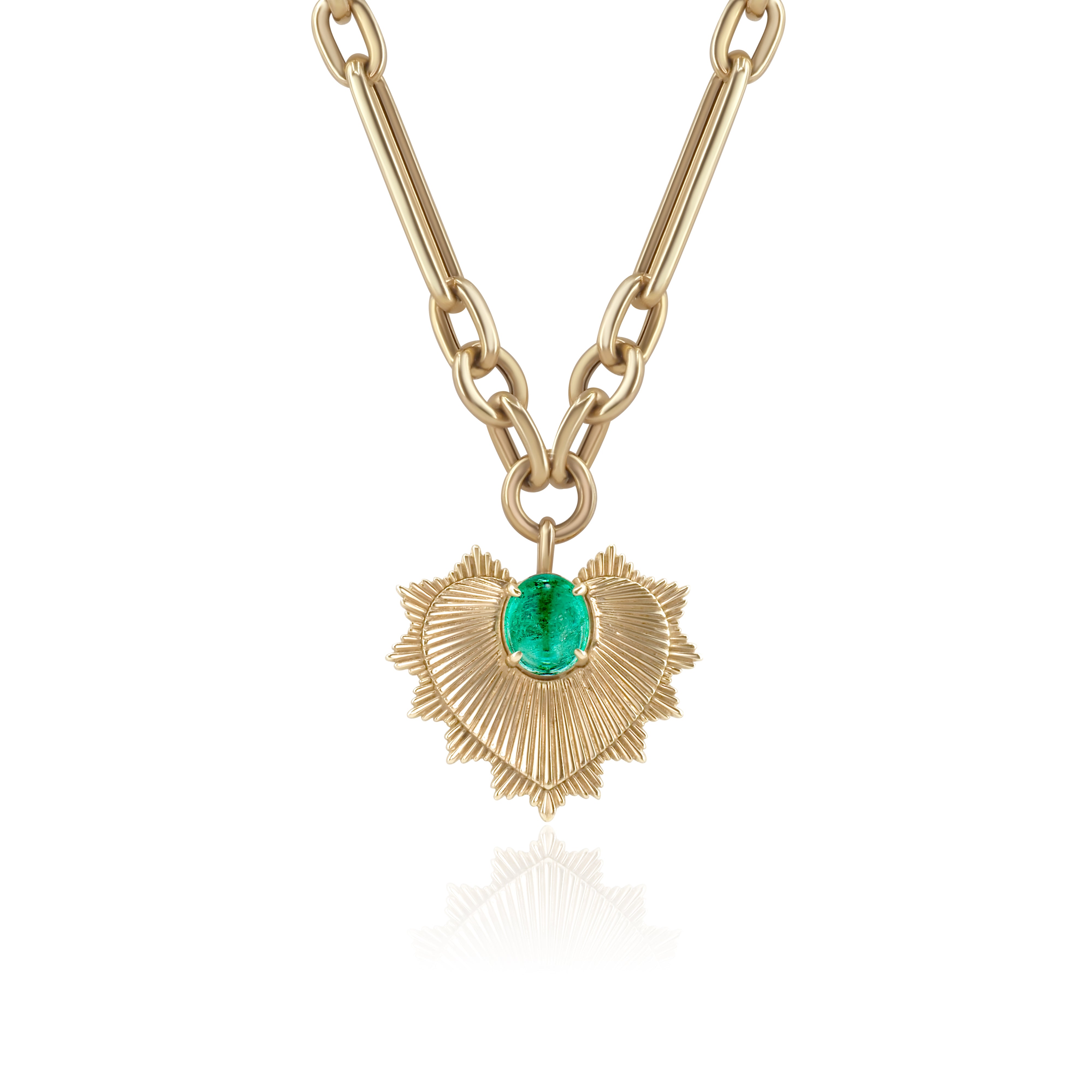 Gold necklace with a heart-shaped pendant featuring a green emerald gemstone on a white background