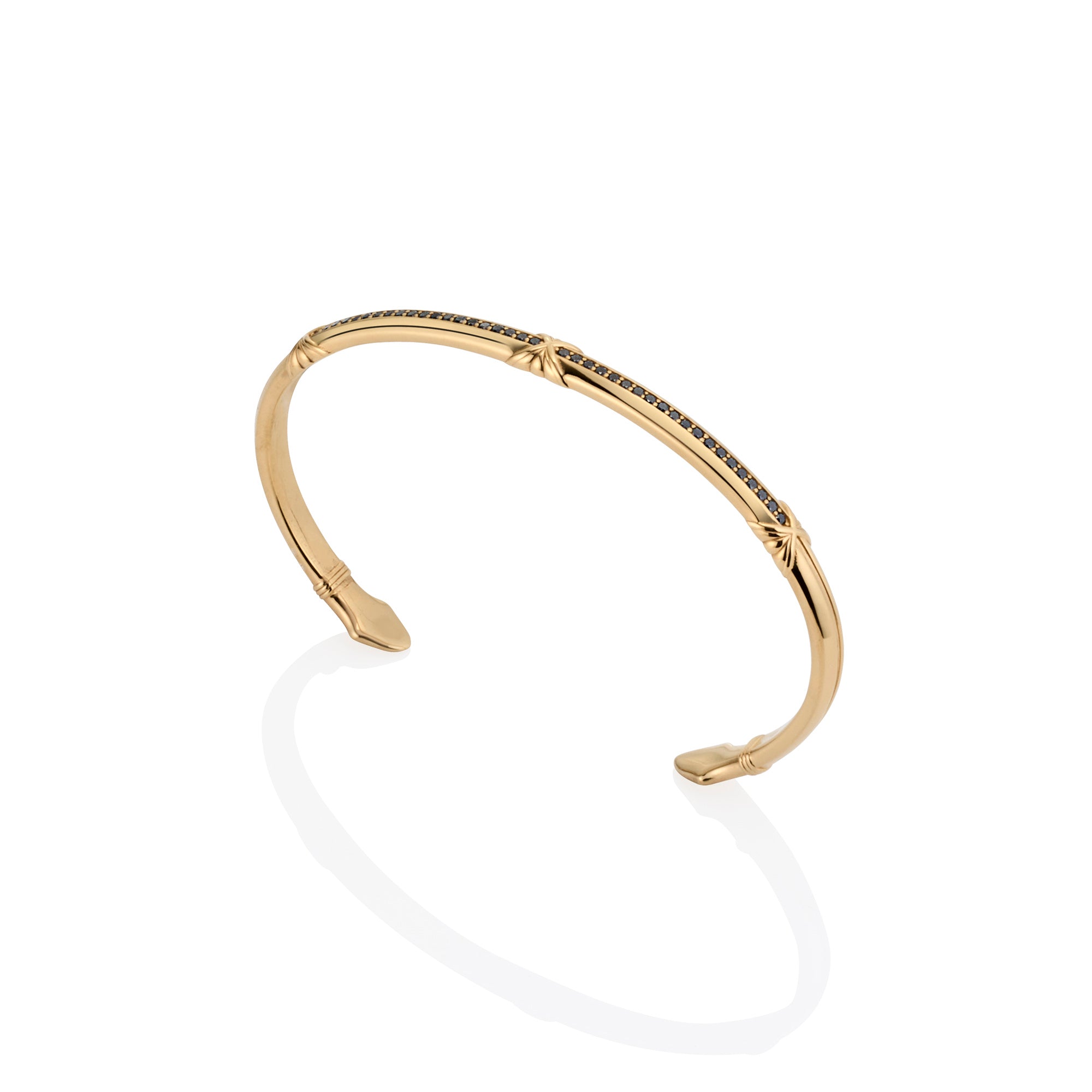 Gold & Black Diamond cuff with arrow ends on a white background, upfront angle
