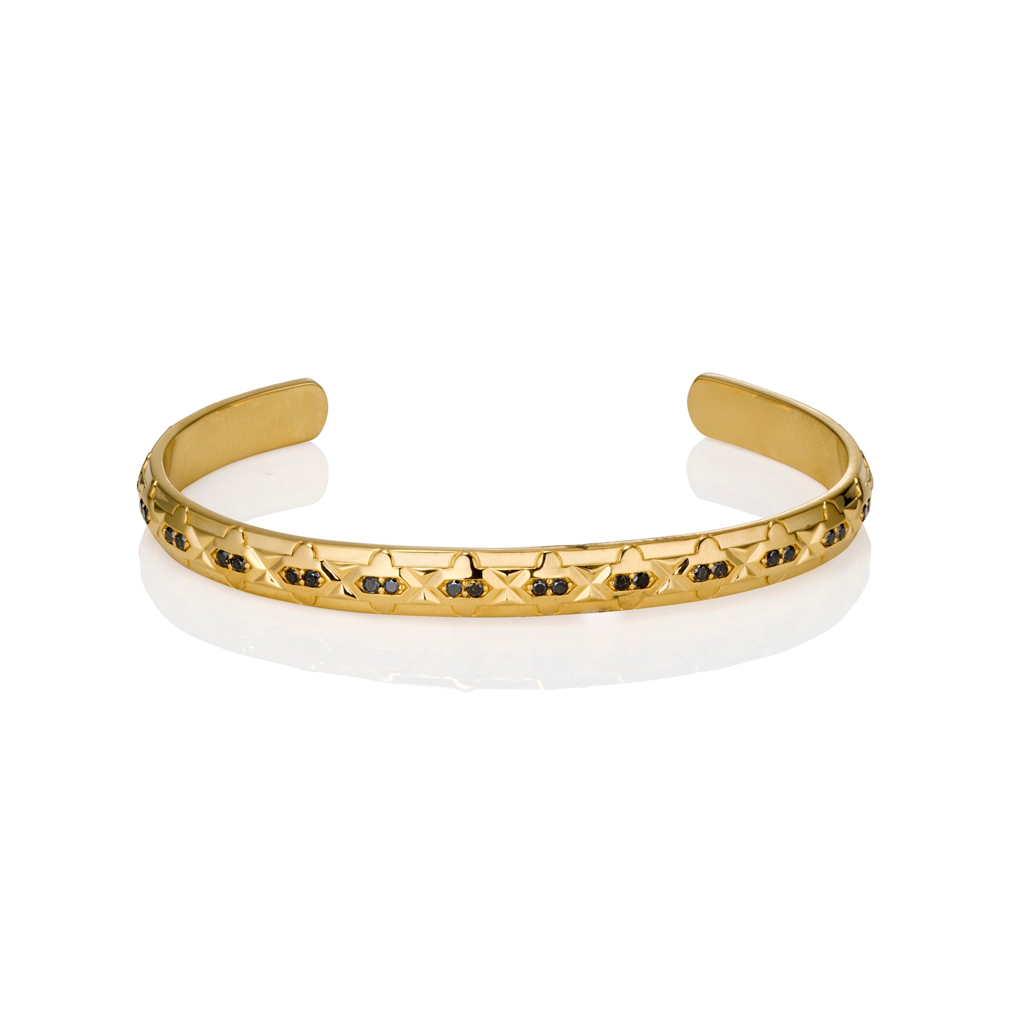 Gold bracelet with black diamonds on a white background