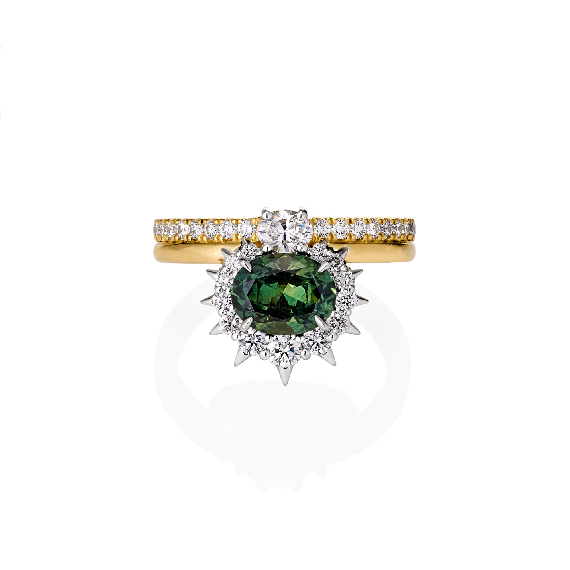 18ct gold & platinum engagement ring with an oval blue-green Australian sapphire, spiked diamond halo, and smaller diamonds