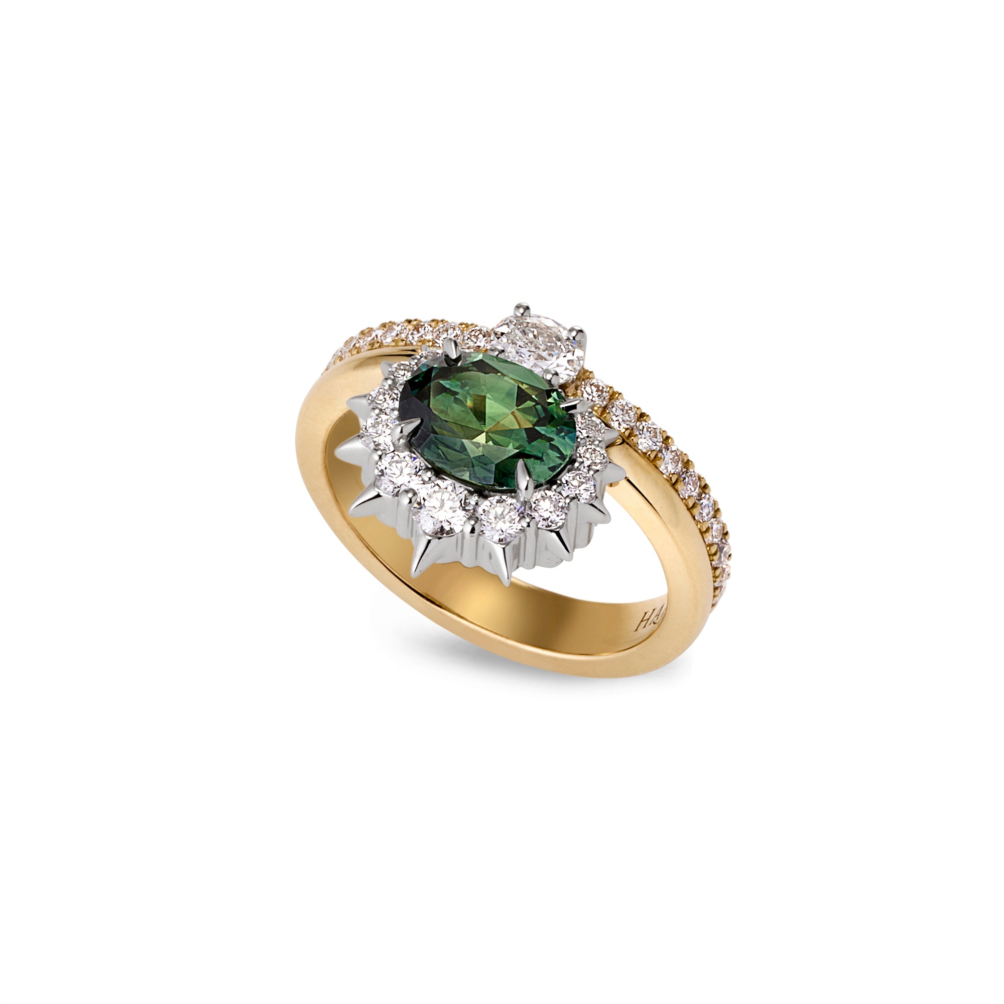 Side angle of engagement ring with an oval blue-green Australian sapphire, spiked diamond halo, and smaller diamonds