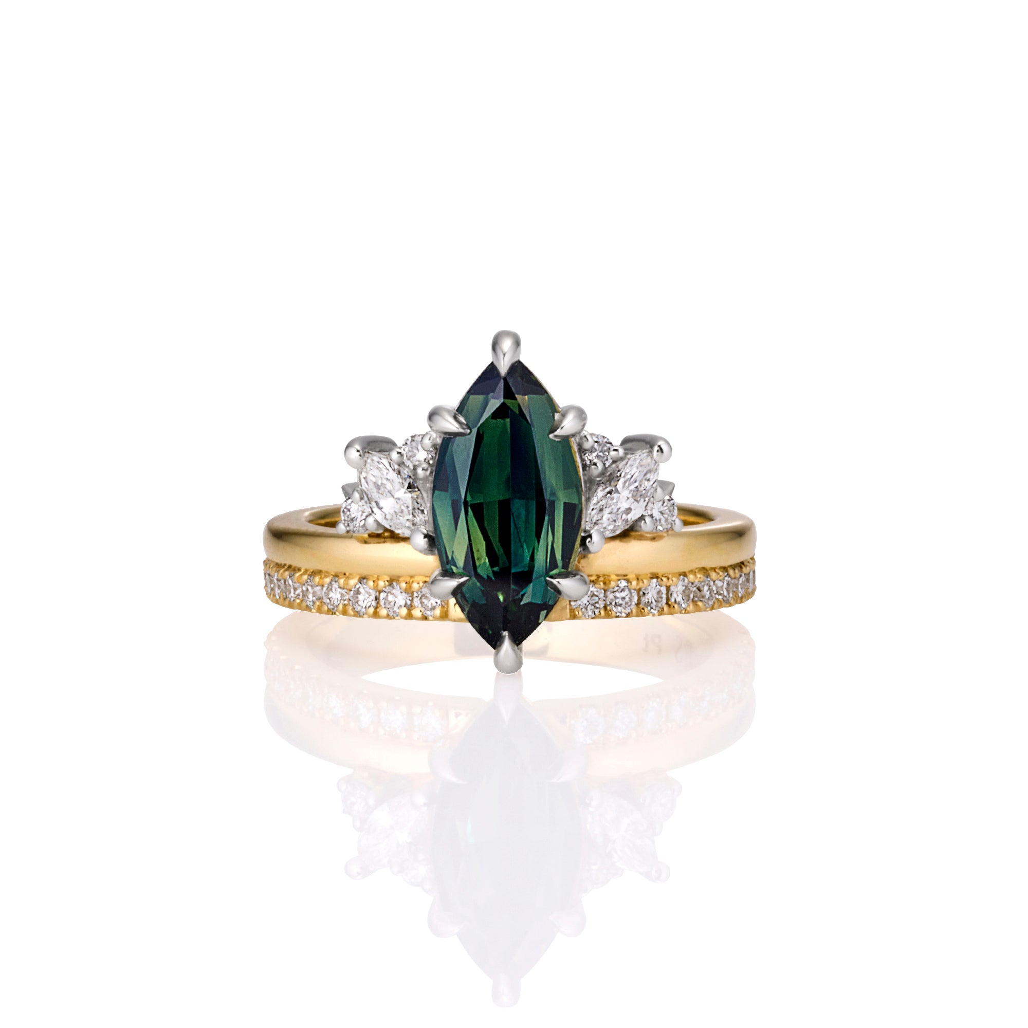 Gold ring with a teal green marquise Australian sapphire and diamond accents on gold and diamond band. 