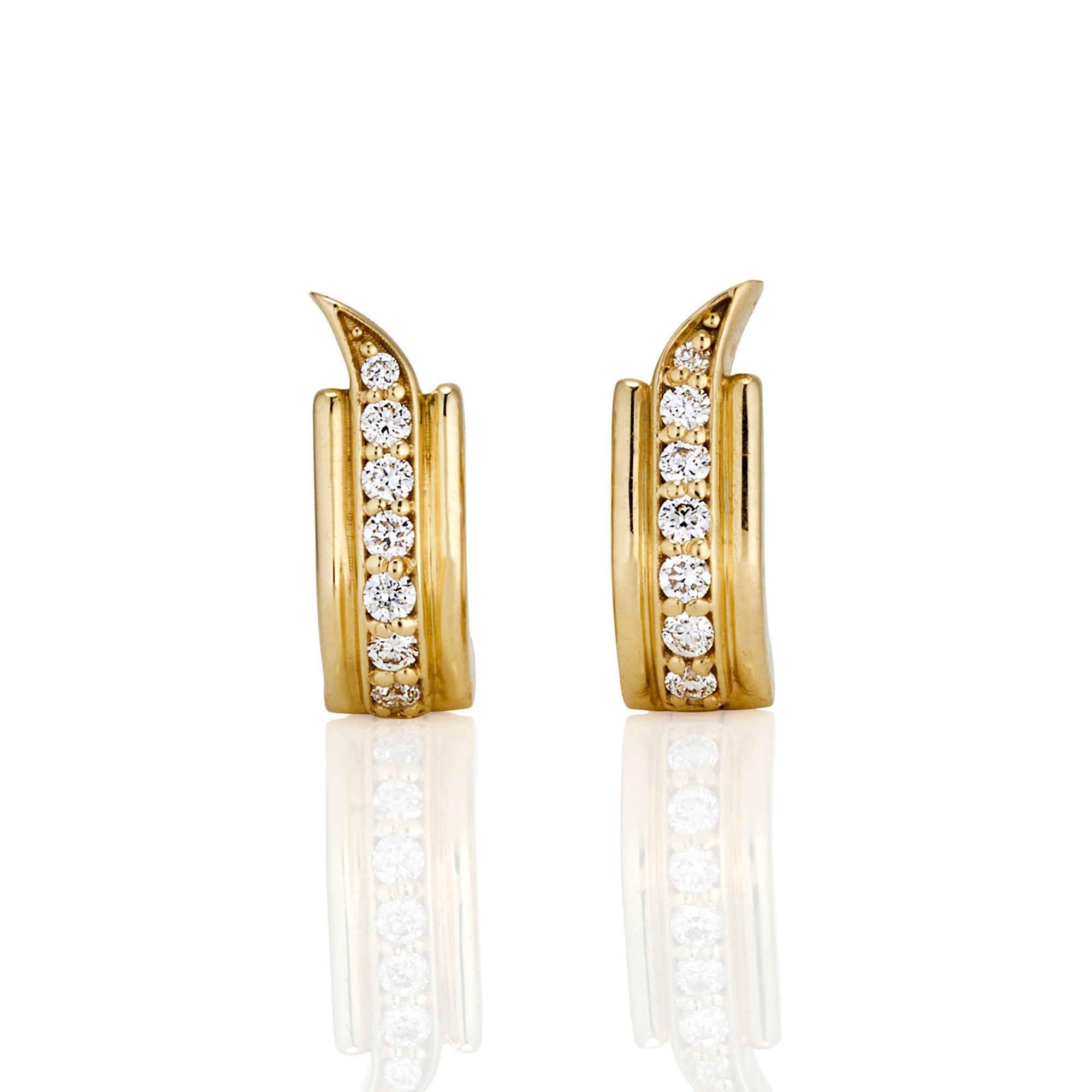 A pair of gold earrings with a curved design, each featuring a vertical row of seven round white gemstones.