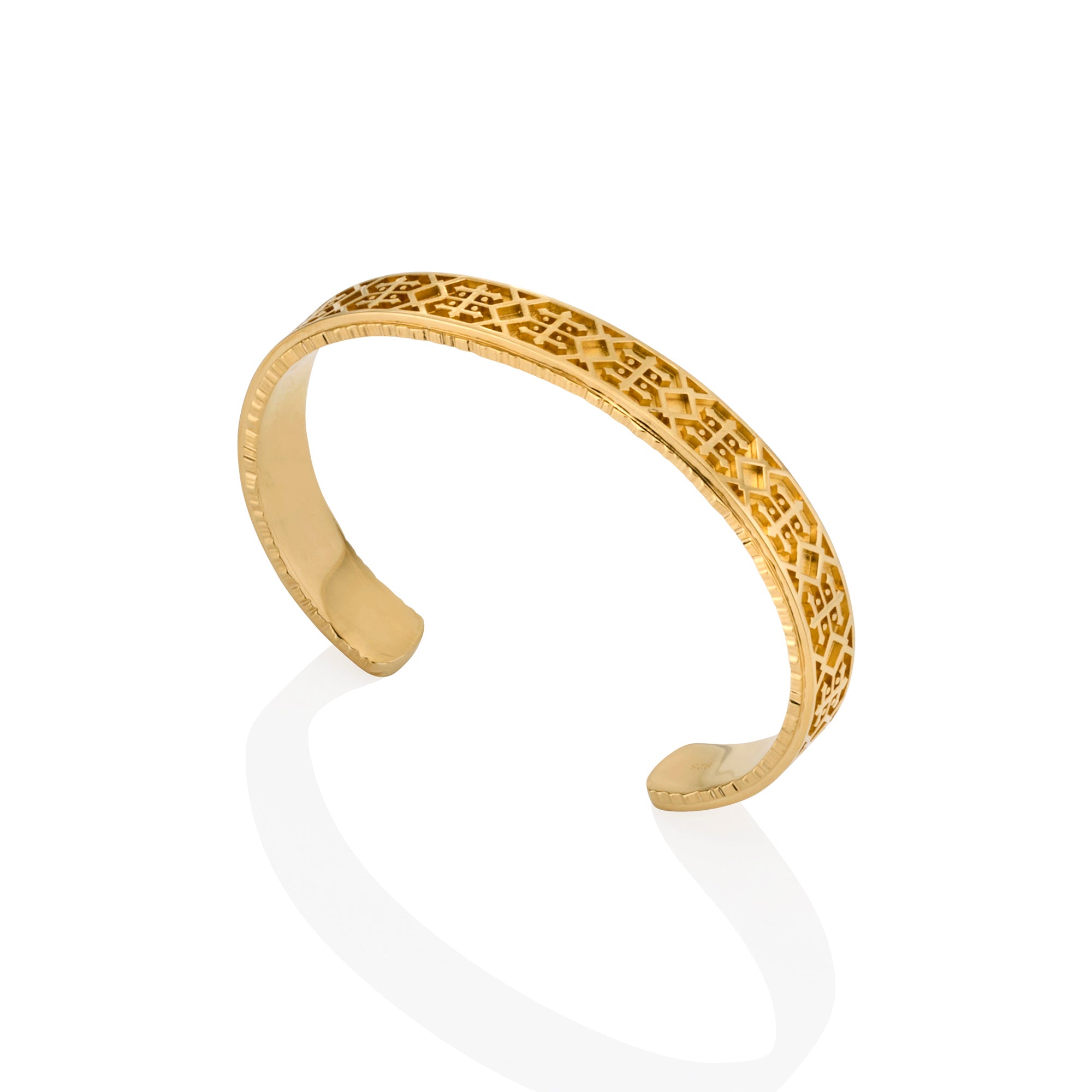 14ct yellow gold cuff bracelet, South West inspired design, high polish finish upright angle on white background.