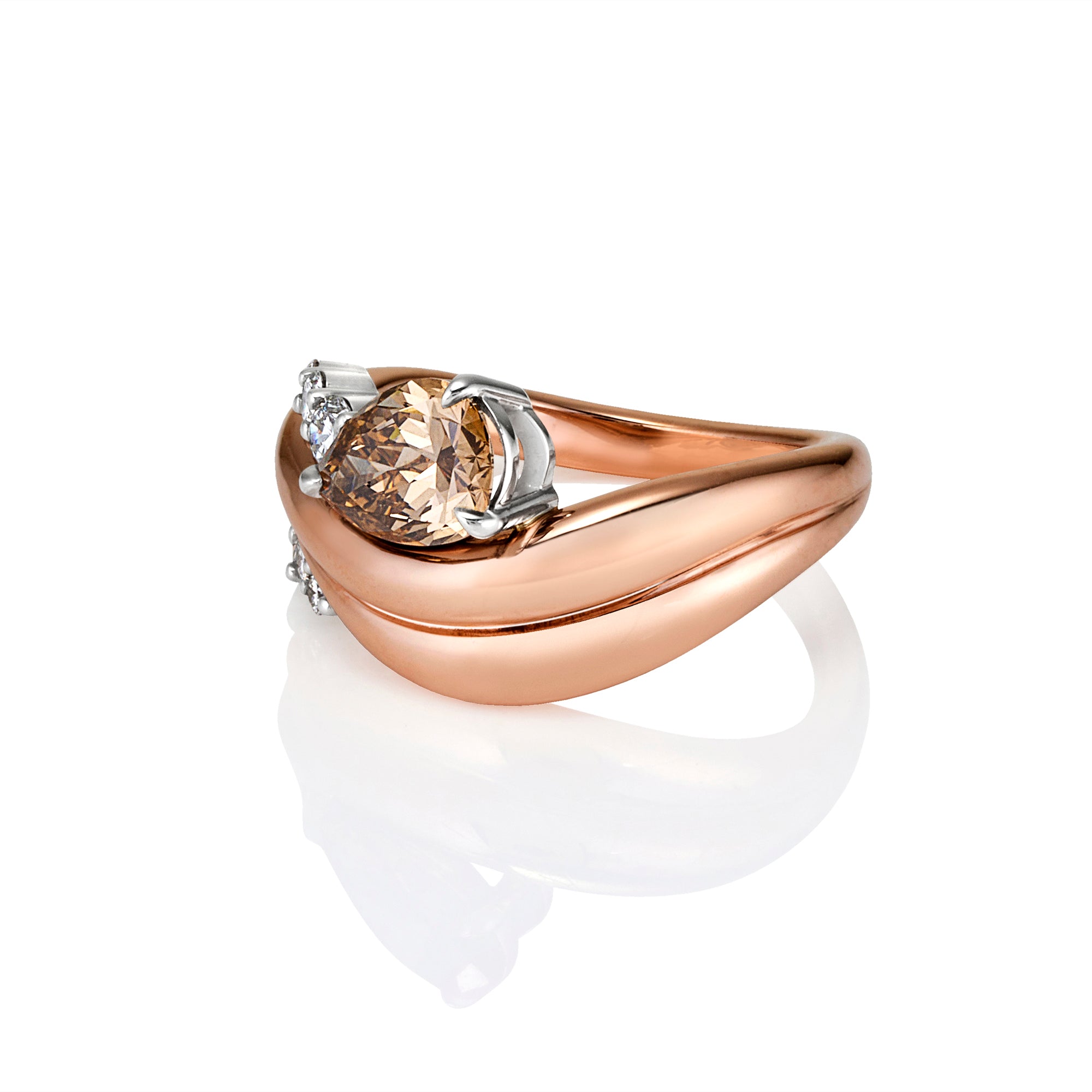 A rose gold ring with a curved, wave-like band and a central oval-cut champagne-colored gemstone set in silver-colored metal, shown on a reflective white surface.