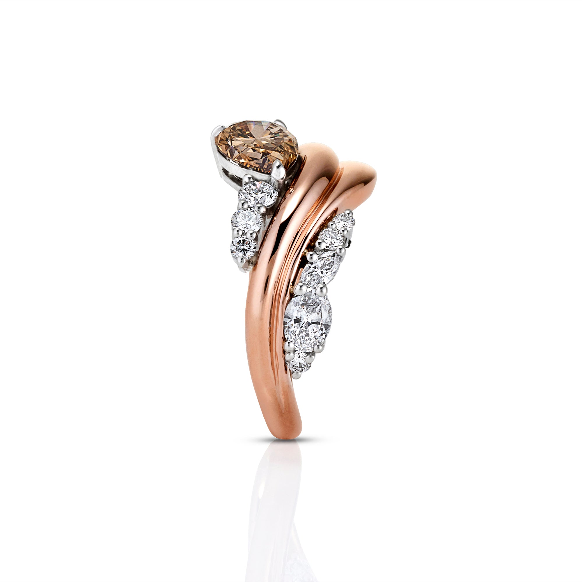 A two-tone ring featuring a rose gold band with pavé-set clear diamonds and a central round-cut champagne-colored gemstone, shown on a clean white background with a soft reflection.