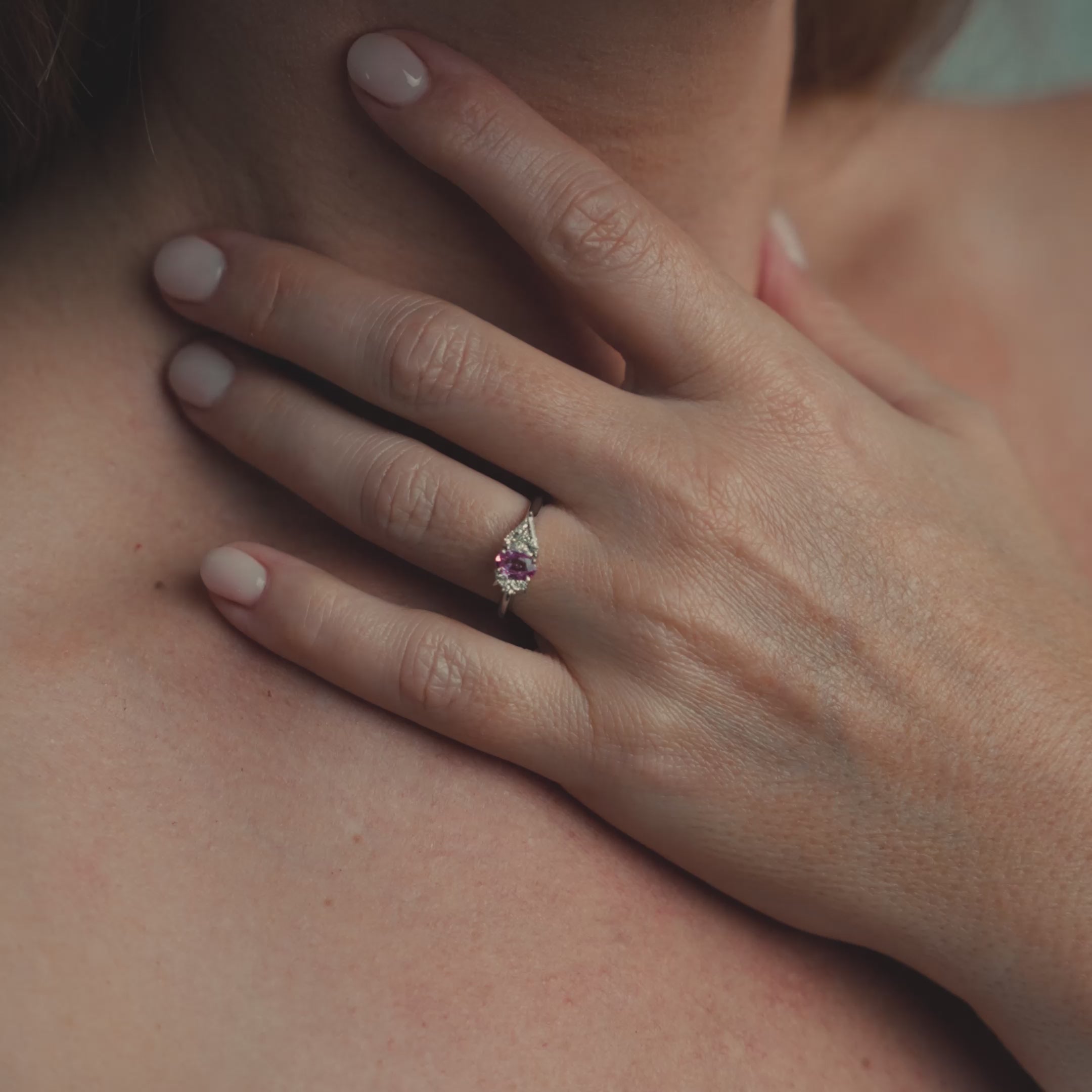 Model wearing ring on engagement ring finger