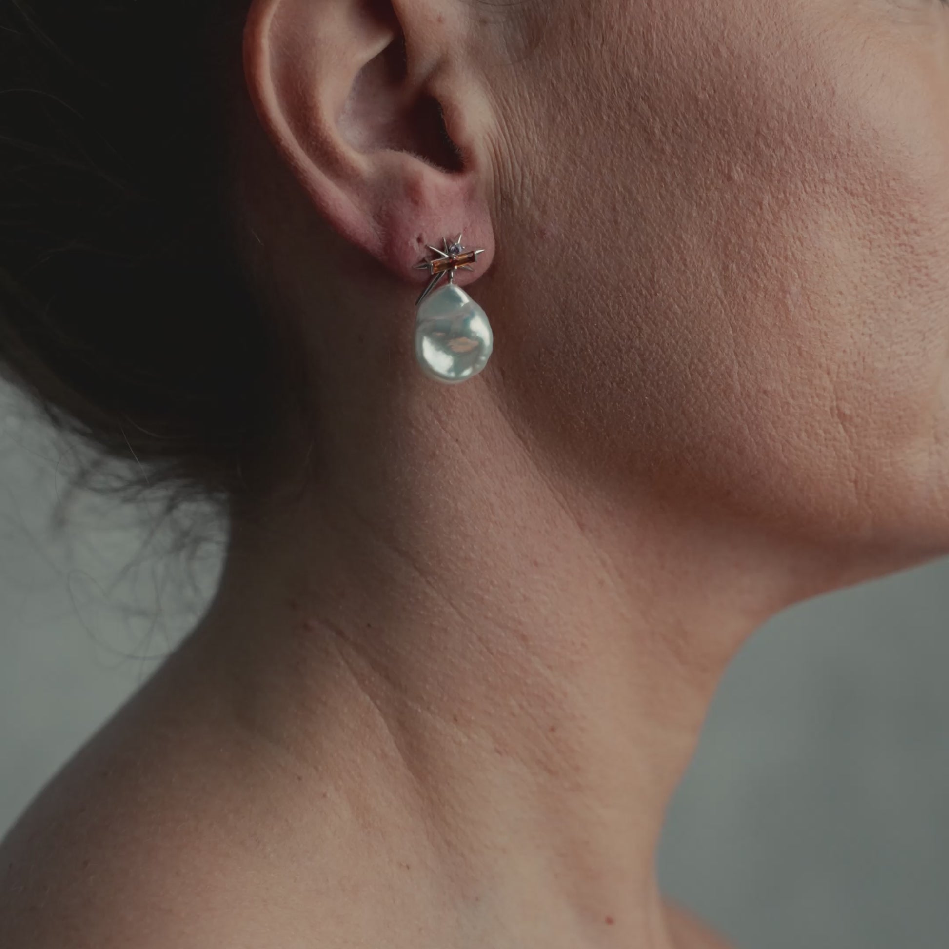 Model wearing pearl earring