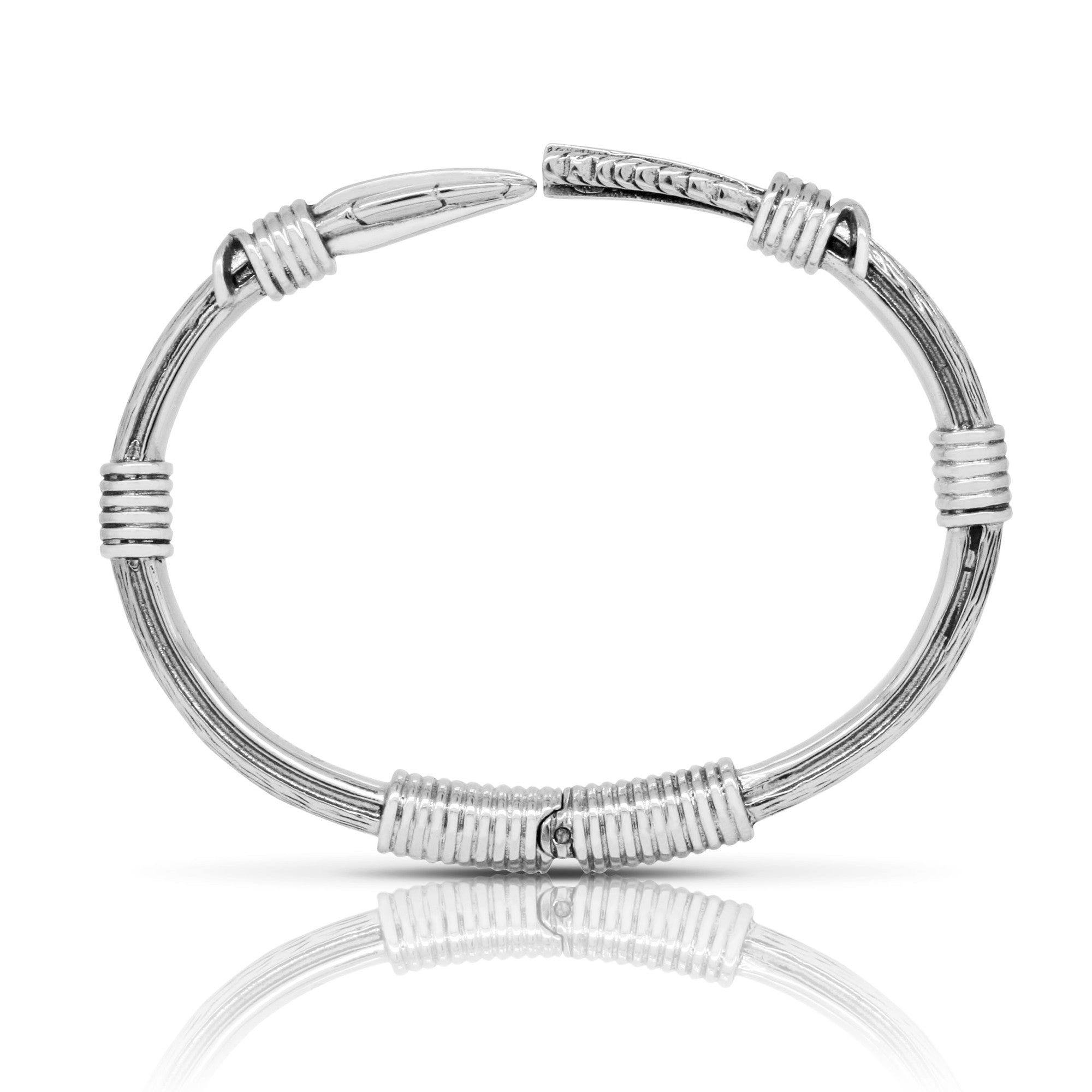 silver feather bracelet. silver feather cuff. feather jewellery. designer bracelets 