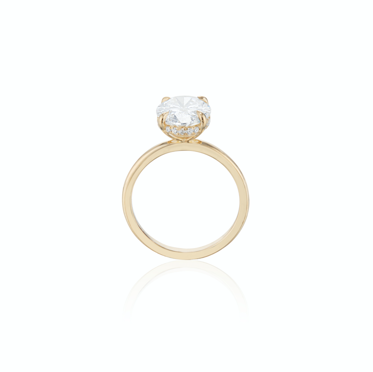 Gold engagement ring with a single large diamond on a white background.