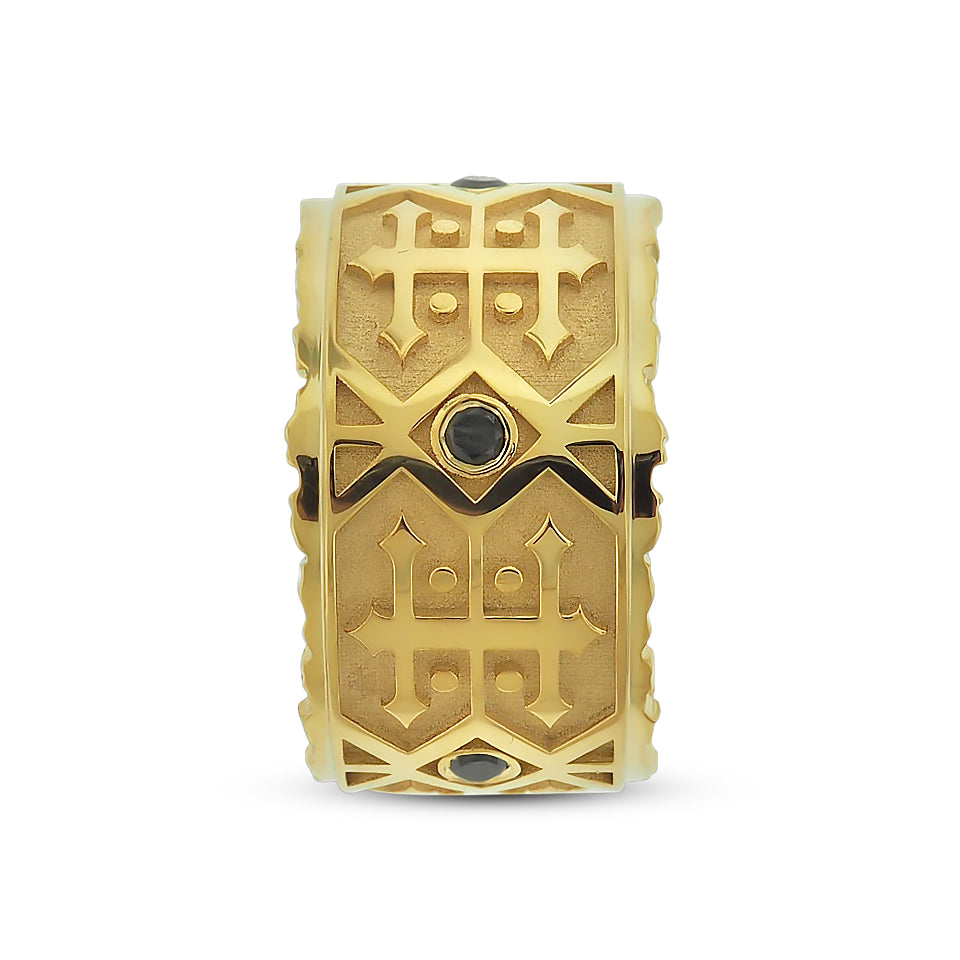 Bezel set round brilliant cut black diamond men's wedding band with jagged edges in yellow gold