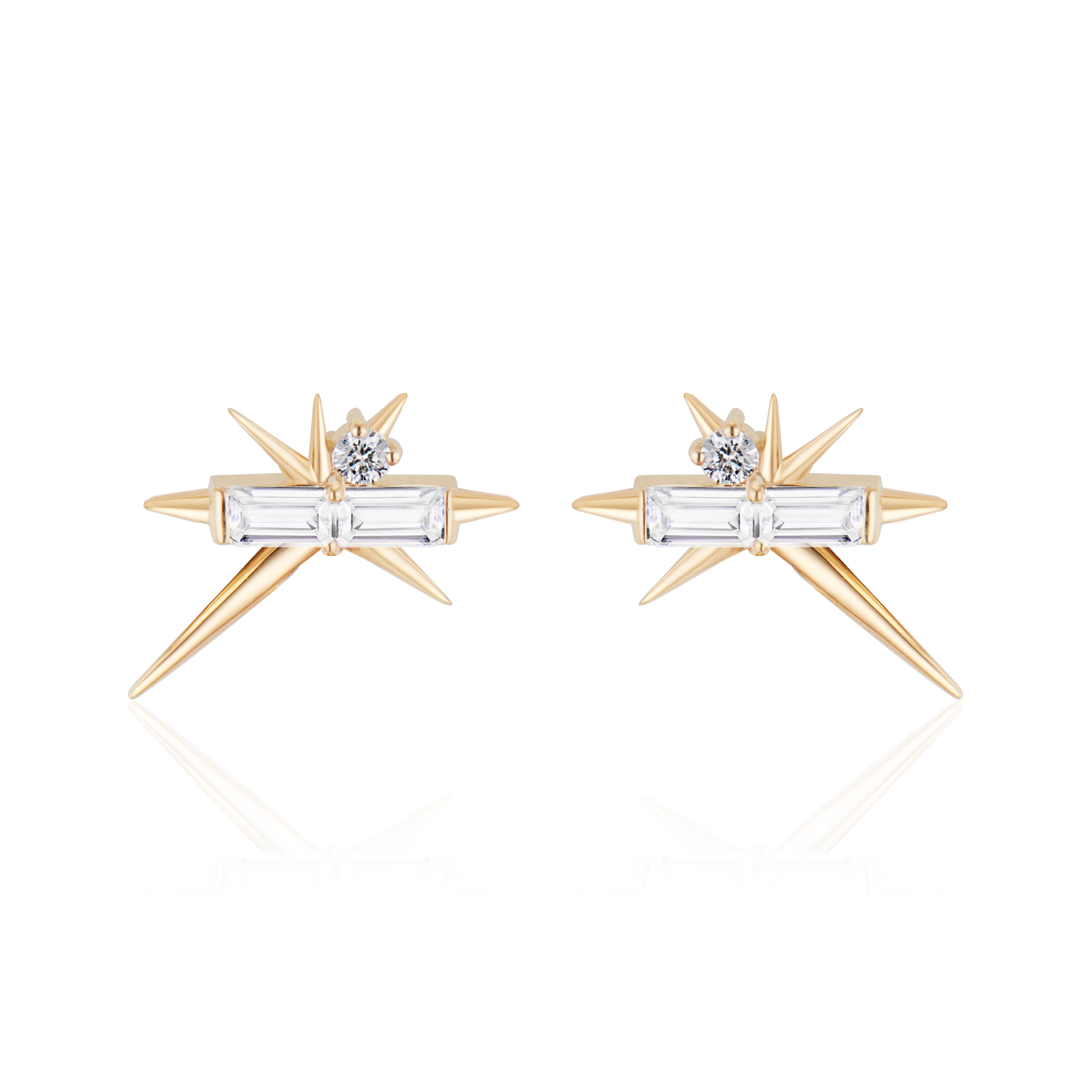 A pair of star-shaped gold earrings with diamond accents on a white background.