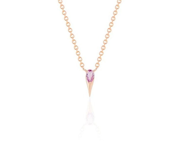 Front view of unique pink sapphire pendant necklace connected to a rose gold round-link chain by 2 angled rose gold prongs. The pear-shaped pink sapphire stone is set at the top of a rose gold spike that drops below, forming a water droplet shape. 